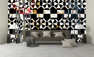 קיר הצורות הגאומטריות בשחור לבן וכתמי צבע.